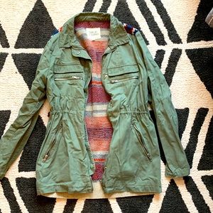 Green army jacket with sweater fabric / pattern on the back